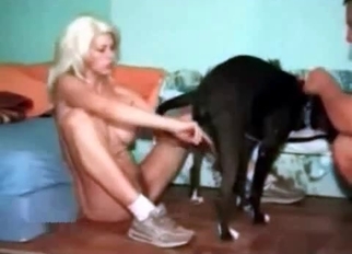 Sexy blonde babe drilled by her black dog