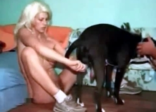 Sexy blonde babe drilled by her black dog