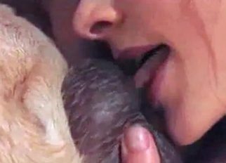 Beauty babe is blowing a big animal cock