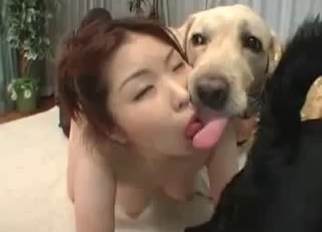 Redhead Asian kisses her lovely doggy