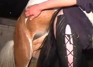 Leather pants MILF violated by a horse